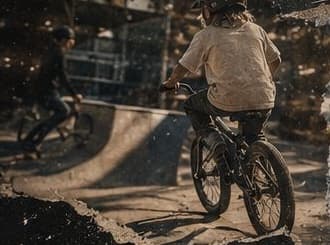 Kid riding a bike at the skatepark